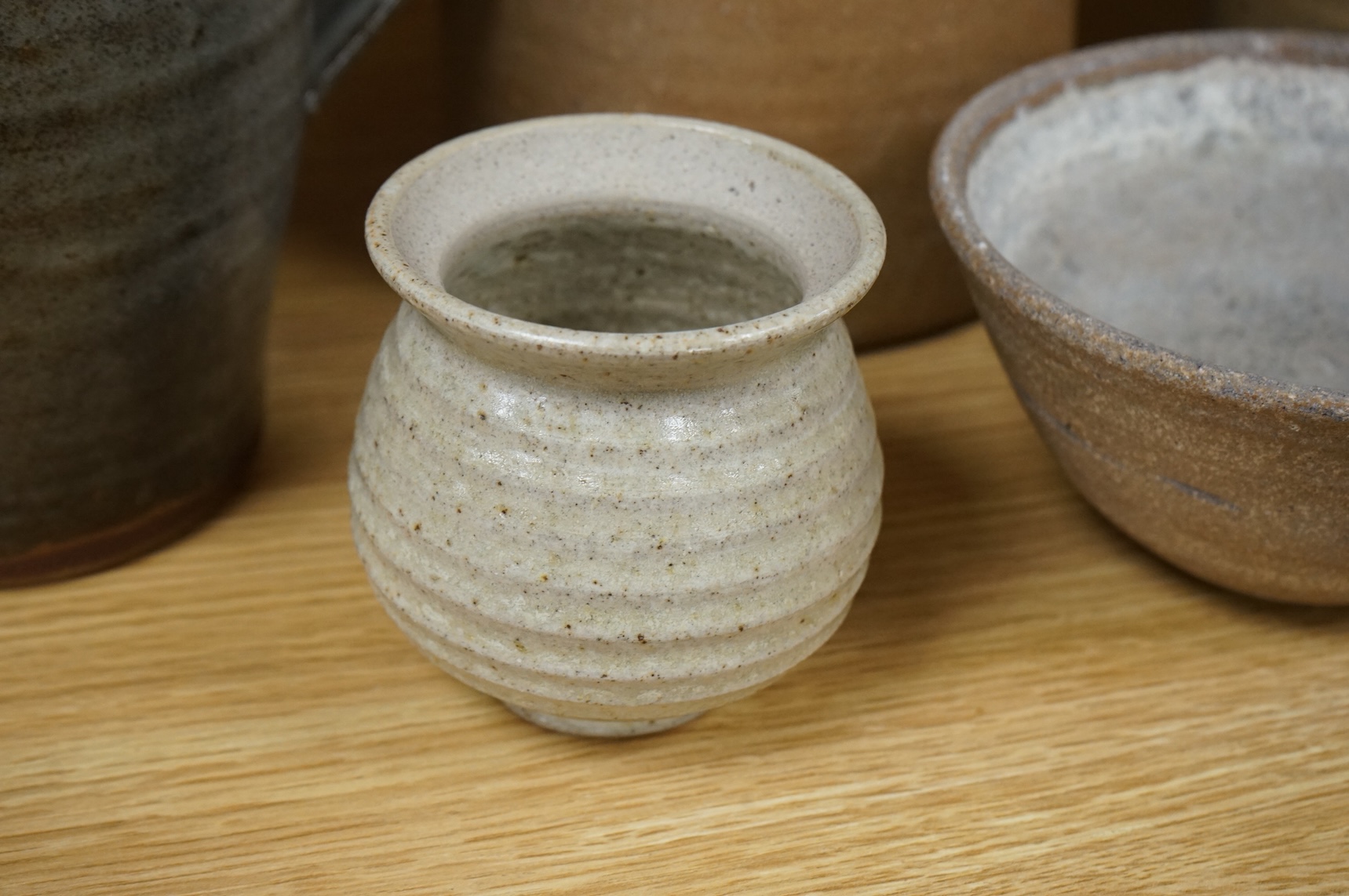 A group of Leach St. Ives pottery jugs and a pot and three other studio items of studio ceramics, some with impressed marks, largest 25cm high